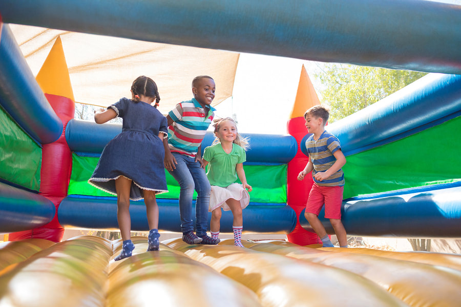 children playing in the inflatable
