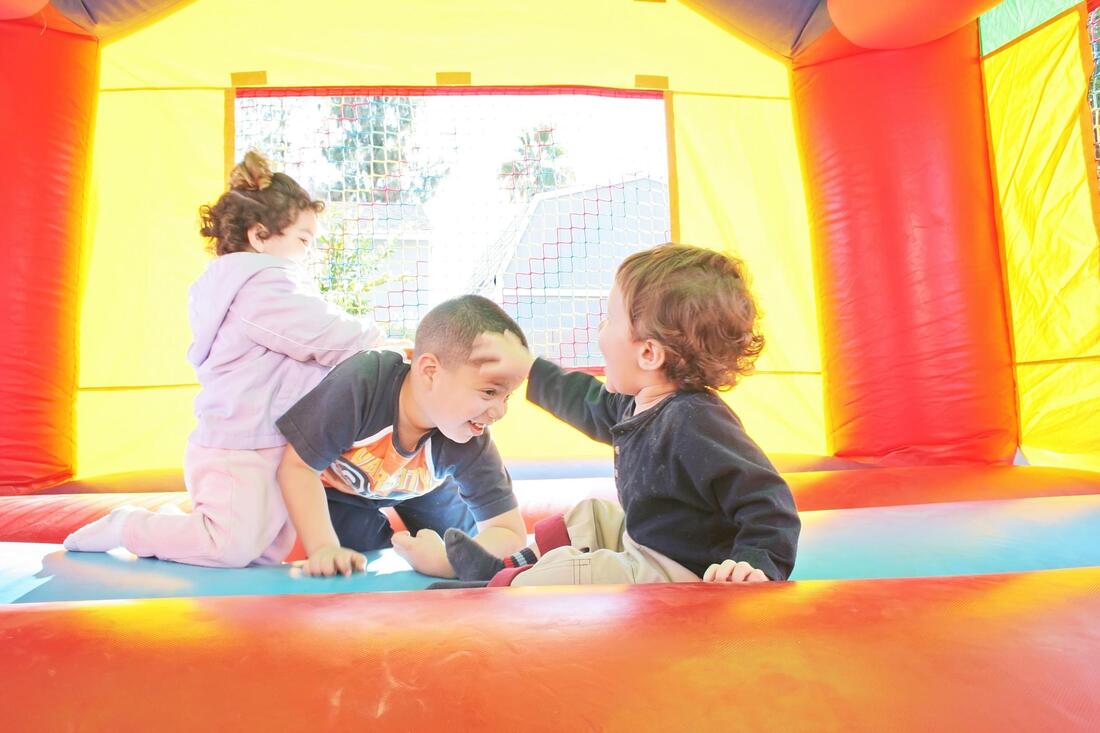 children playing inside the inflatable
